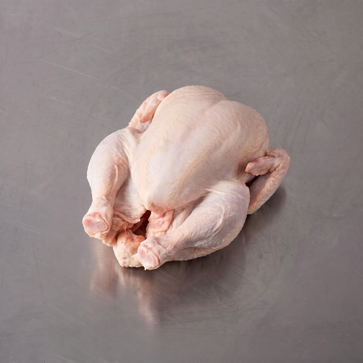 Free Range Whole Chicken ~1.4kg on stainless steel butcher's bench