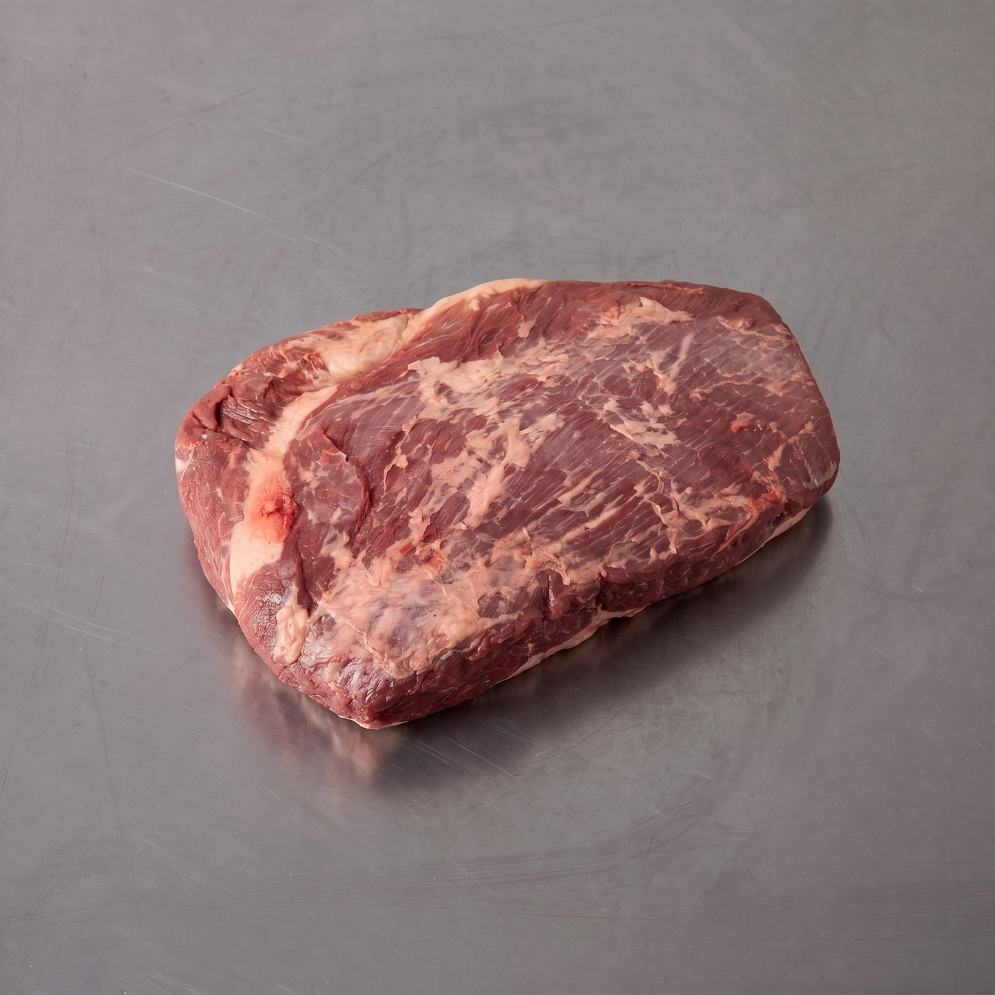 Grass Fed Brisket ~1.2kg on stainless steel butcher's bench