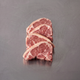 Grass Fed Lamb Loin Chops ~500g on stainless steel butcher's bench