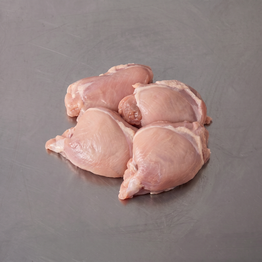 Free Range Chicken Thigh Fillets ~500g on stainless steel butcher's bench