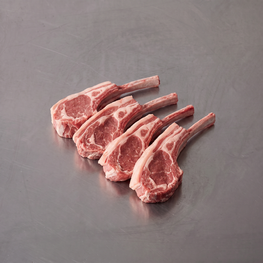 Grass Fed Lamb Cutlets ~500g on stainless steel butcher's bench
