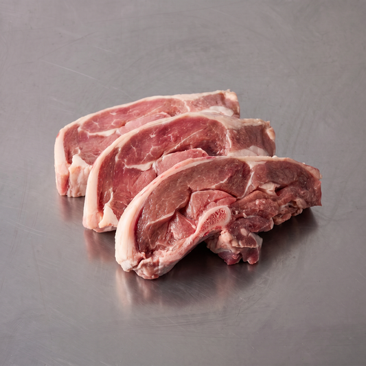 Grass Fed Lamb Chump Chops ~600g on stainless steel butcher's bench