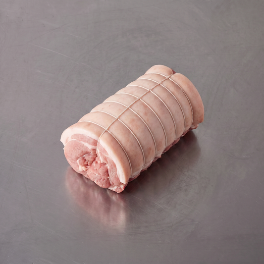 Free Range Pork Boneless Rolled Shoulder Roast ~1.4kg on stainless steel butcher's bench