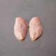 Free Range Chicken Breast Fillets ~1kg on stainless steel butcher's bench