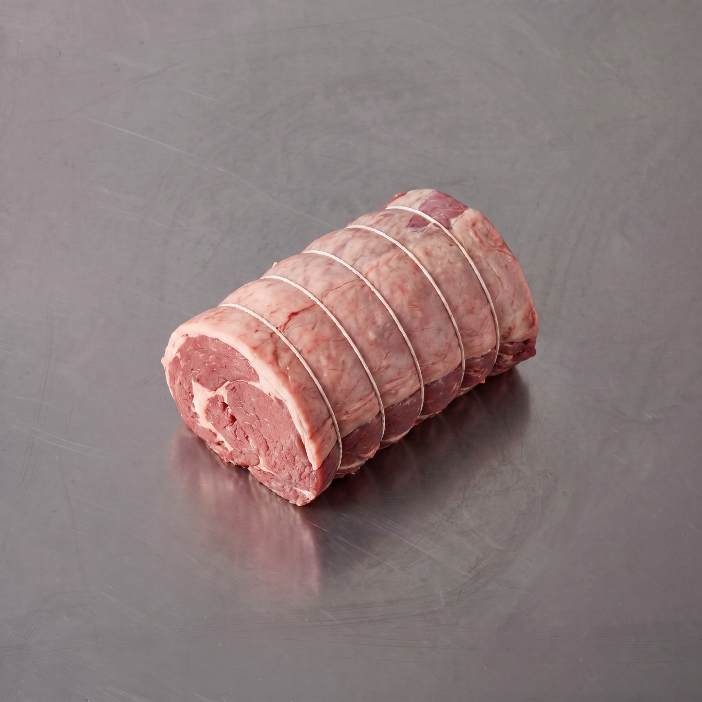 Grass Fed Lamb Shoulder Boneless Roast ~1.2kg on stainless steel butcher's bench