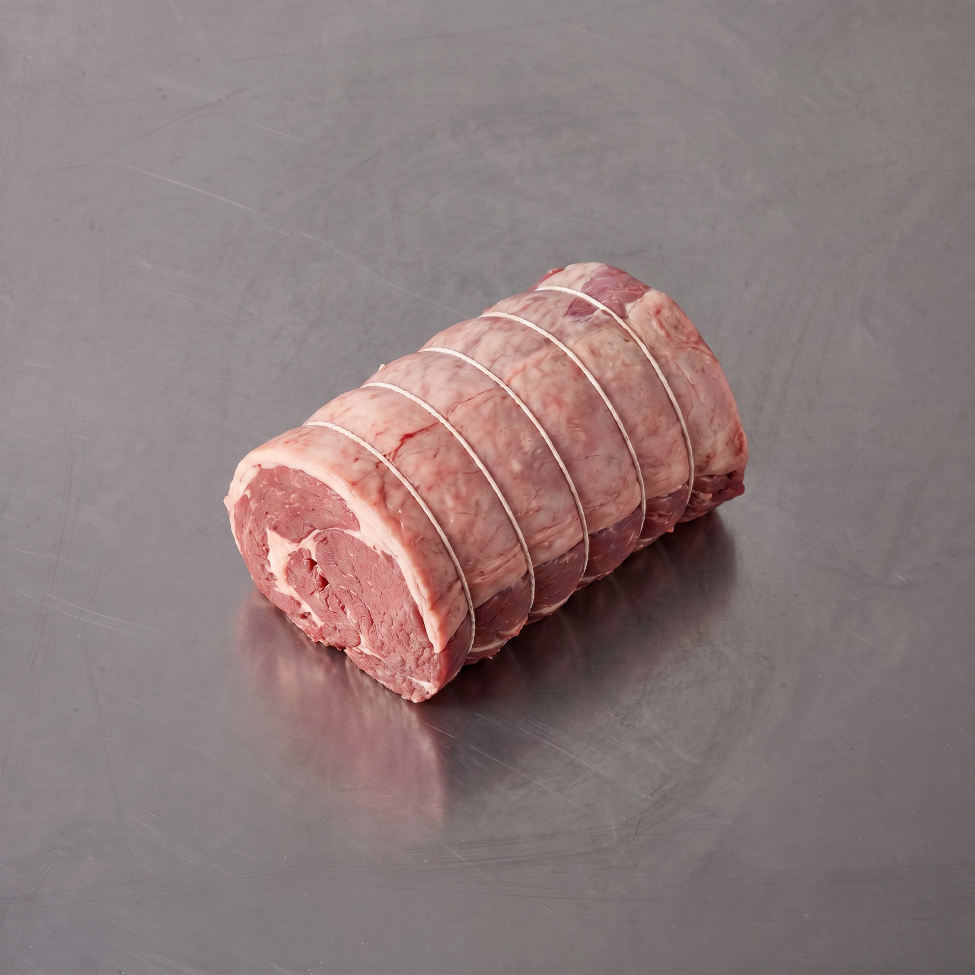 Grass Fed Lamb Shoulder Boneless Roast ~1.2kg on stainless steel butcher's bench