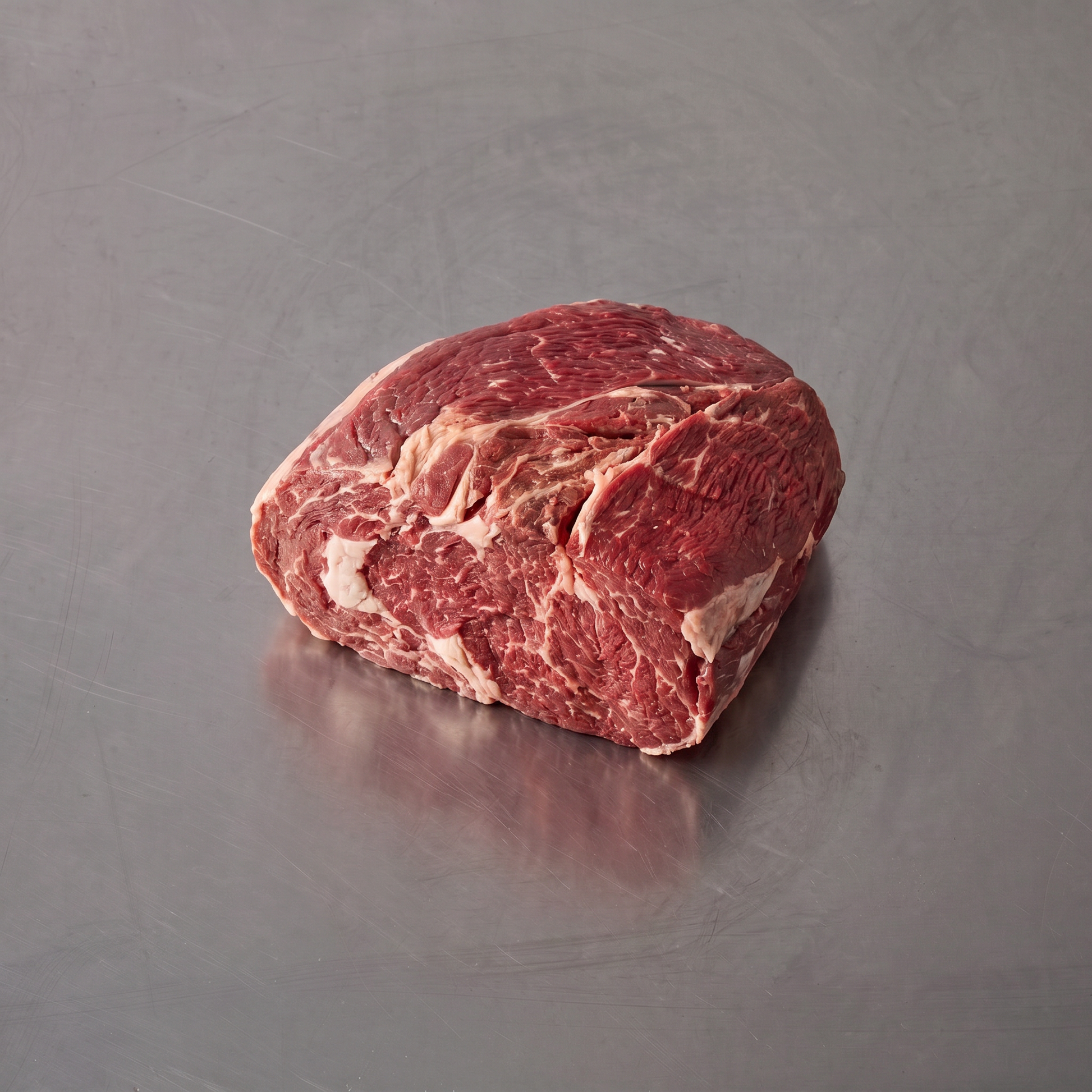 Grass Fed Chuck Roast ~1.2kg on stainless steel butcher's bench